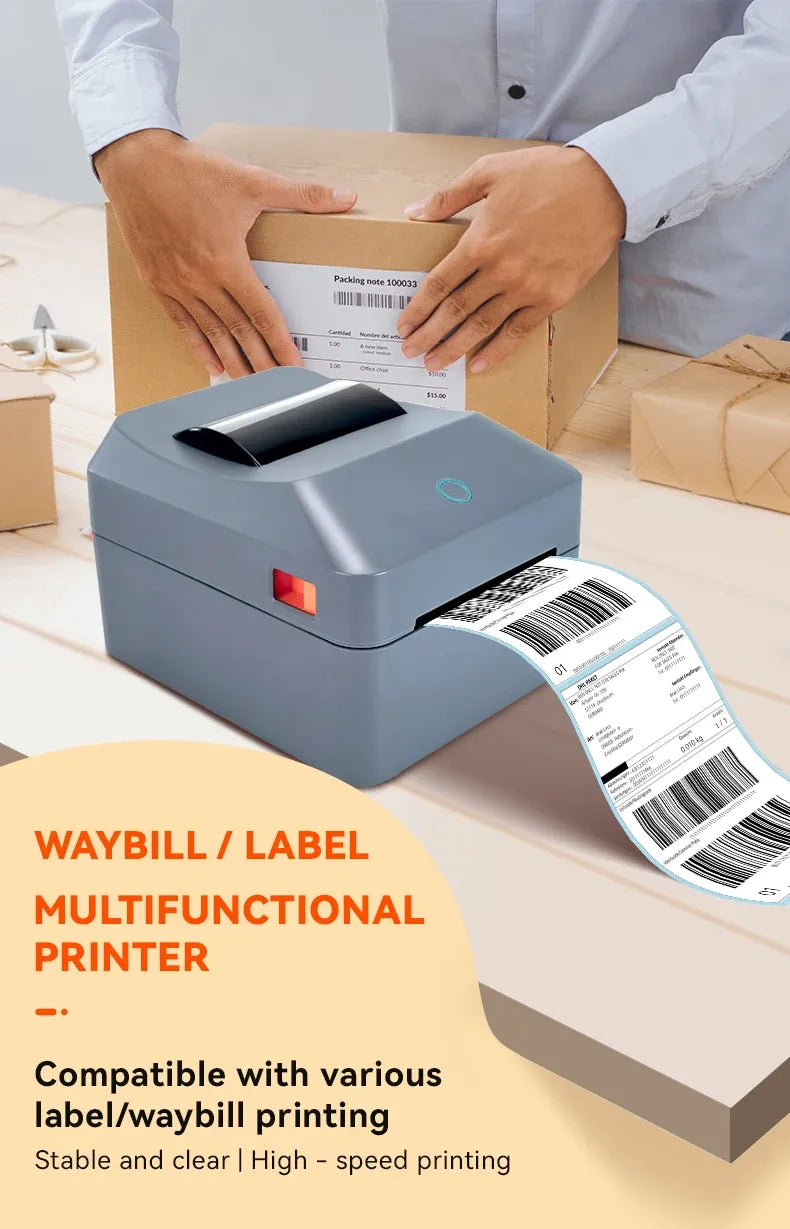 Gray thermal shipping label printer printing labels for a packed cardboard box