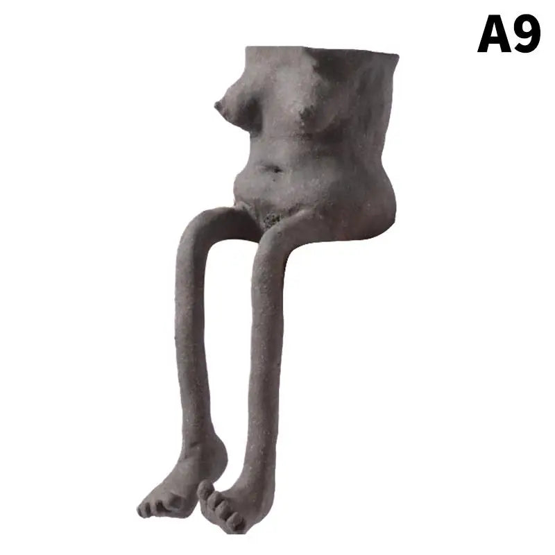 Dark gray resin leggy planter with open top and standing thin legs