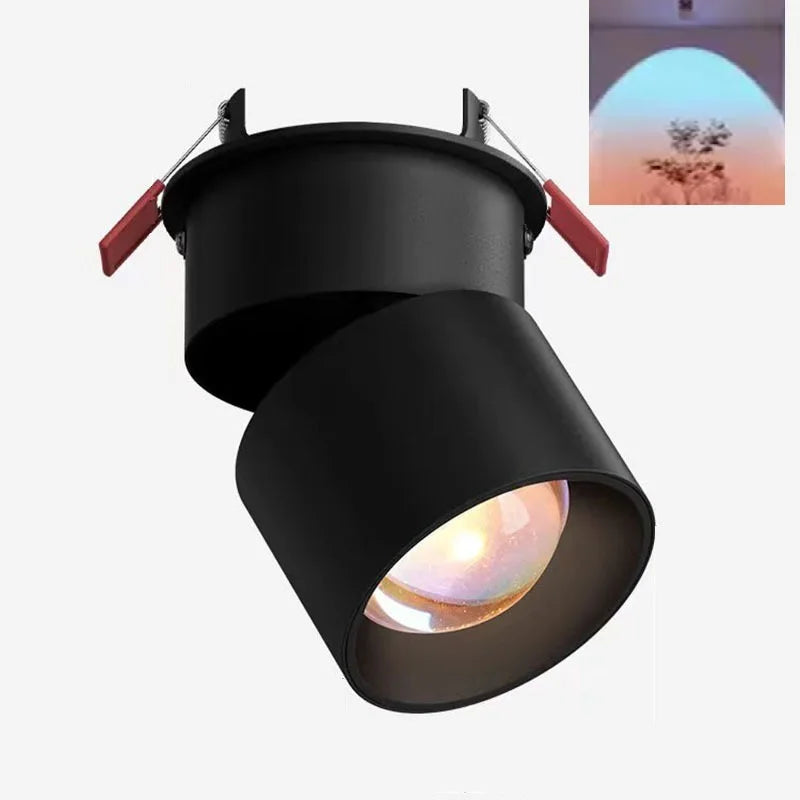 Black LED ceiling spotlight with angled cylindrical head and warm glowing lens opening