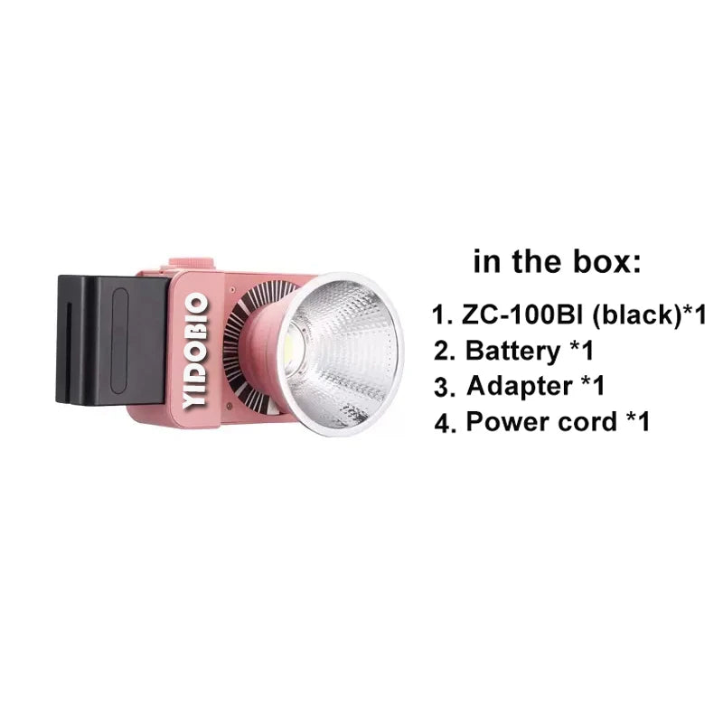 Pink ZC-100BI portable LED video light with a silver reflector, battery attachment, and a list of included accessories.