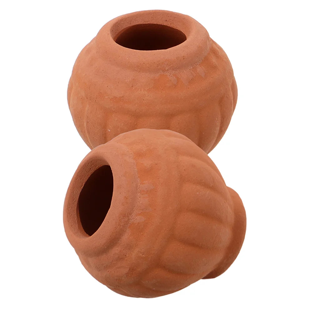 Two small terracotta clay planter pots with top openings and drainage holes