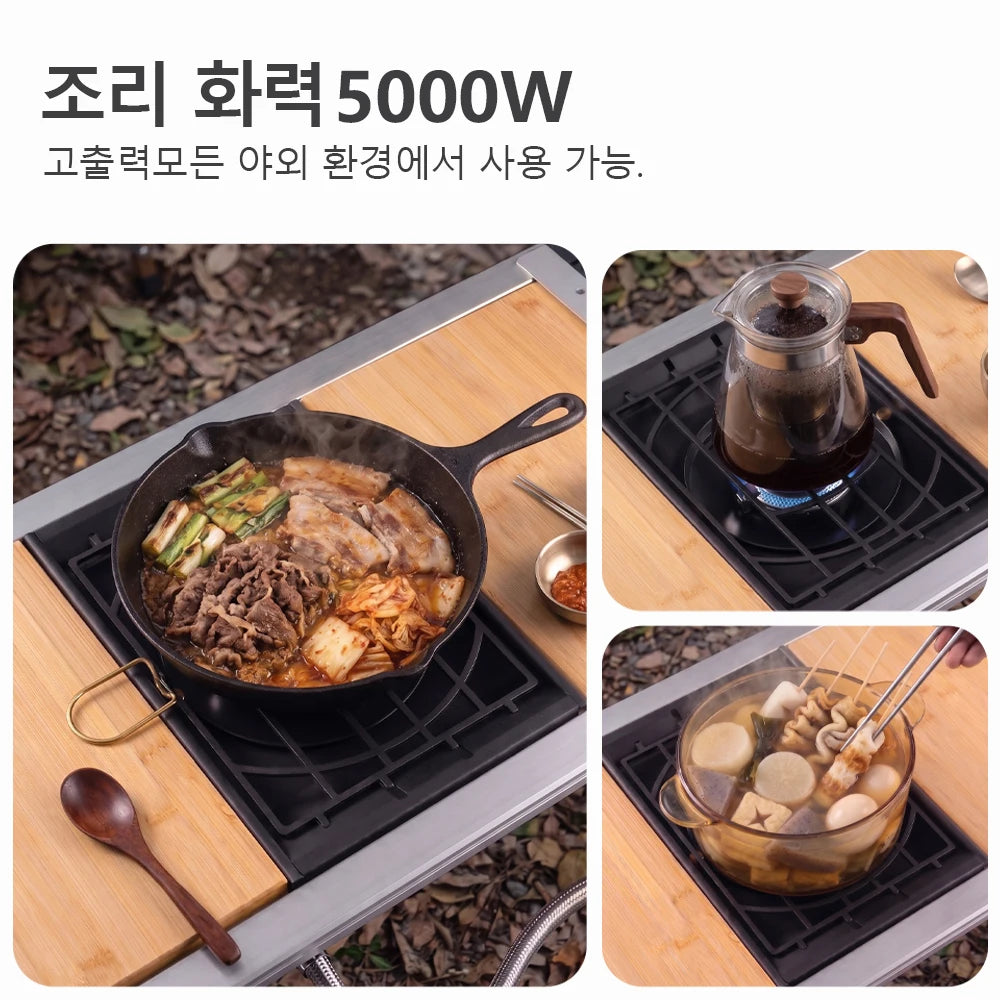 Black camping stove with grate used to cook in a pan on a portable tabletop