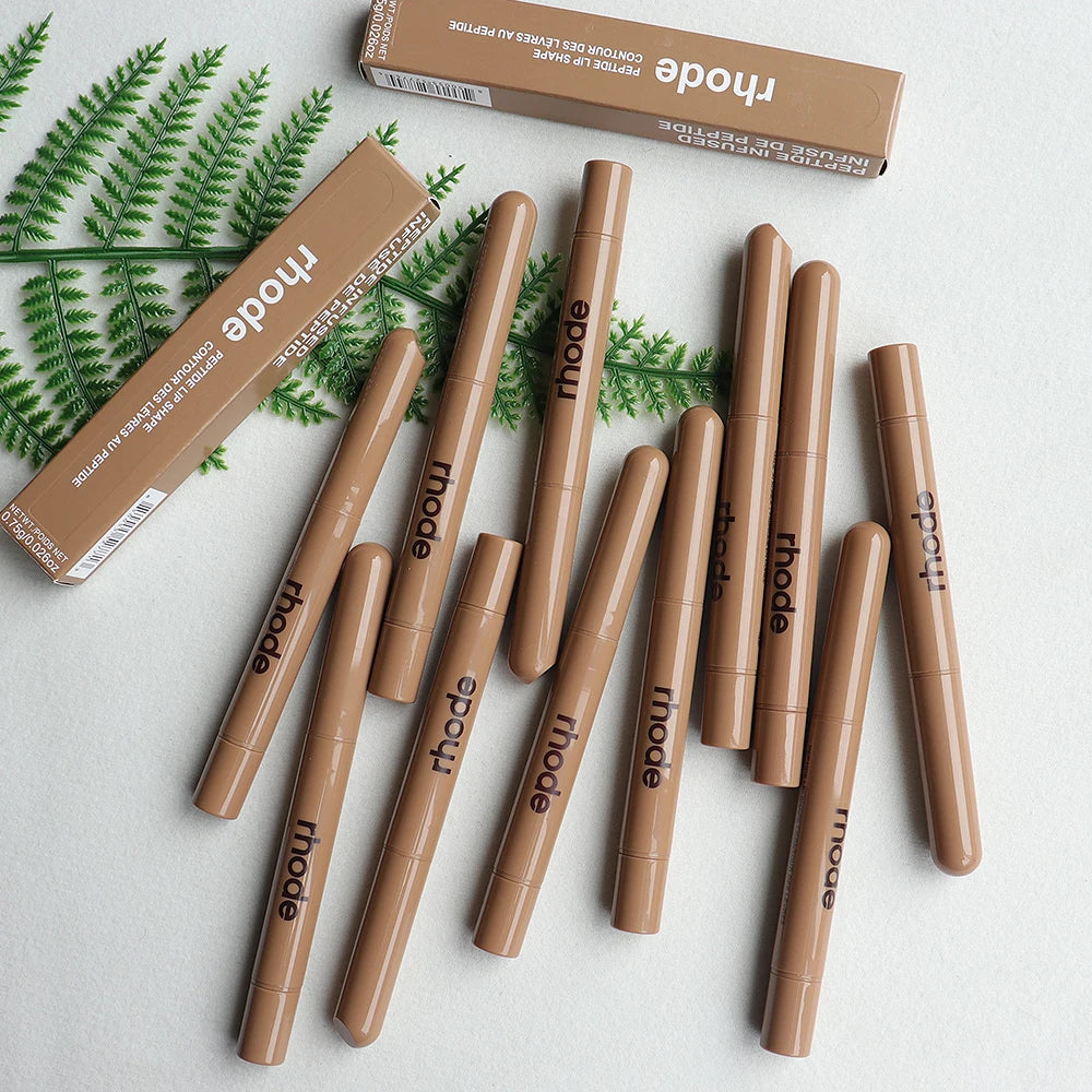 Rhode Skin Peptide Lip Shape pencil liners in tan packaging with matte finish and matching boxes on white background.
