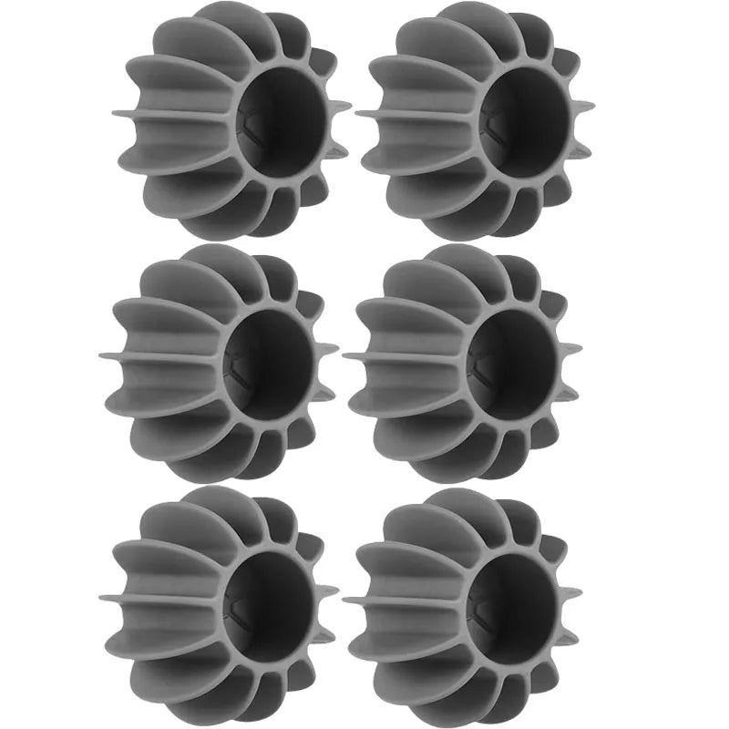 Reusable grey silicone laundry balls for washing machines to remove cat and dog pet hair from clothing.