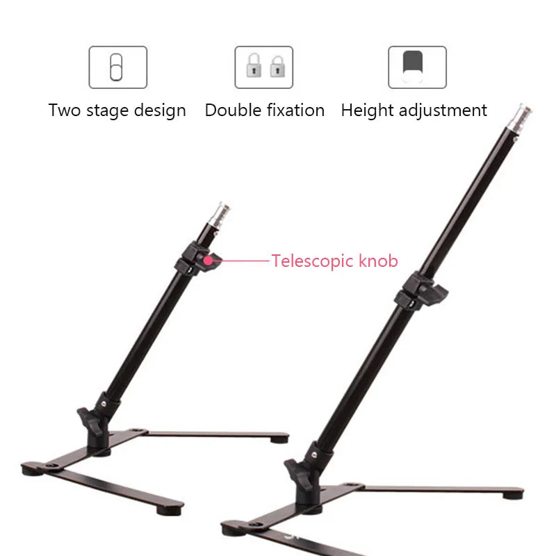 Black adjustable metal light stand with telescopic knob, two-stage design, and stable flat base for equipment support.