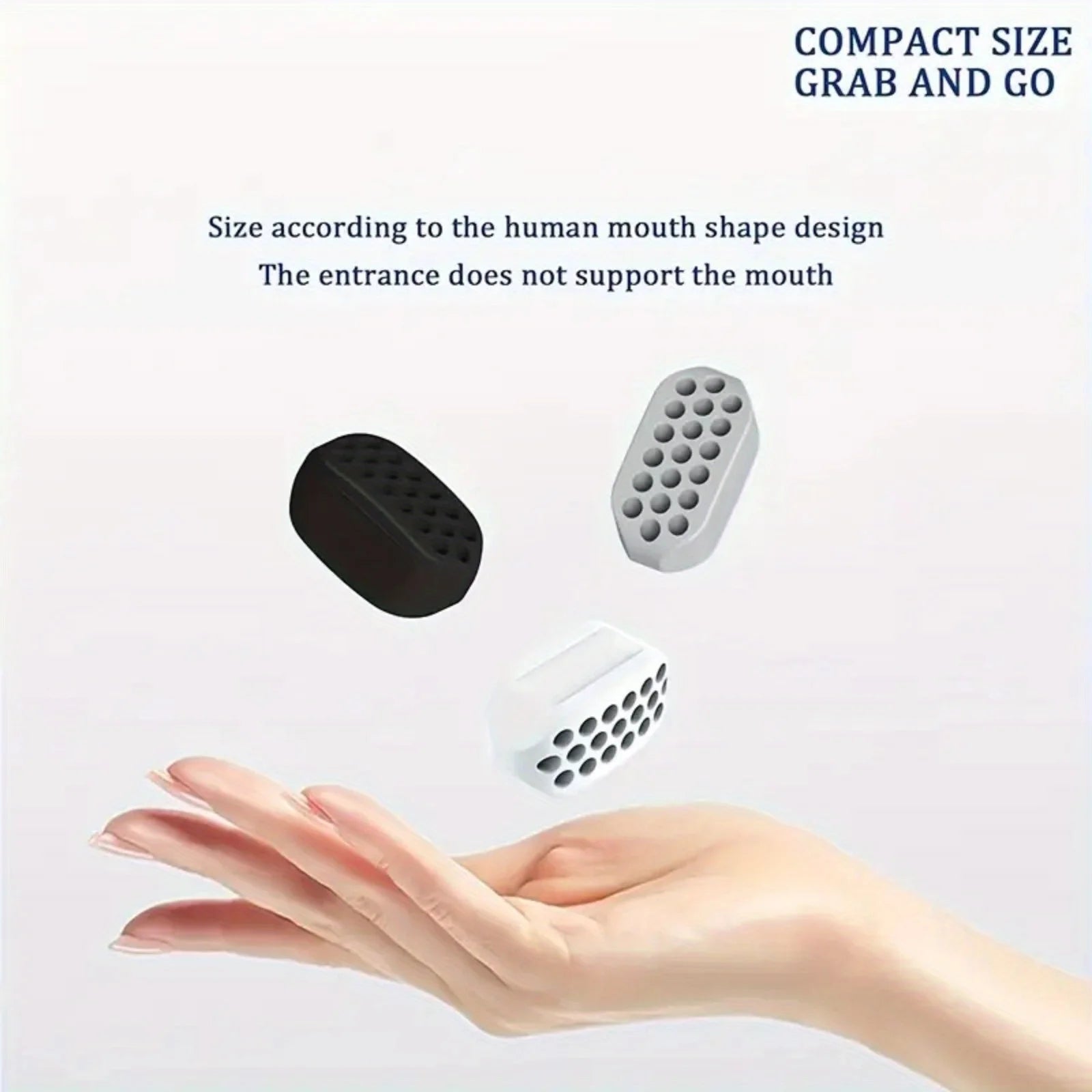 Three silicone jawline trainer balls in black, grey, and white, shown floating above an open palm.