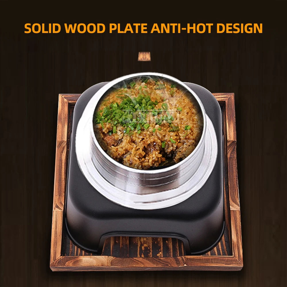 Portable smart multi-cooker with black base and aluminum steamer insert holding cooked food