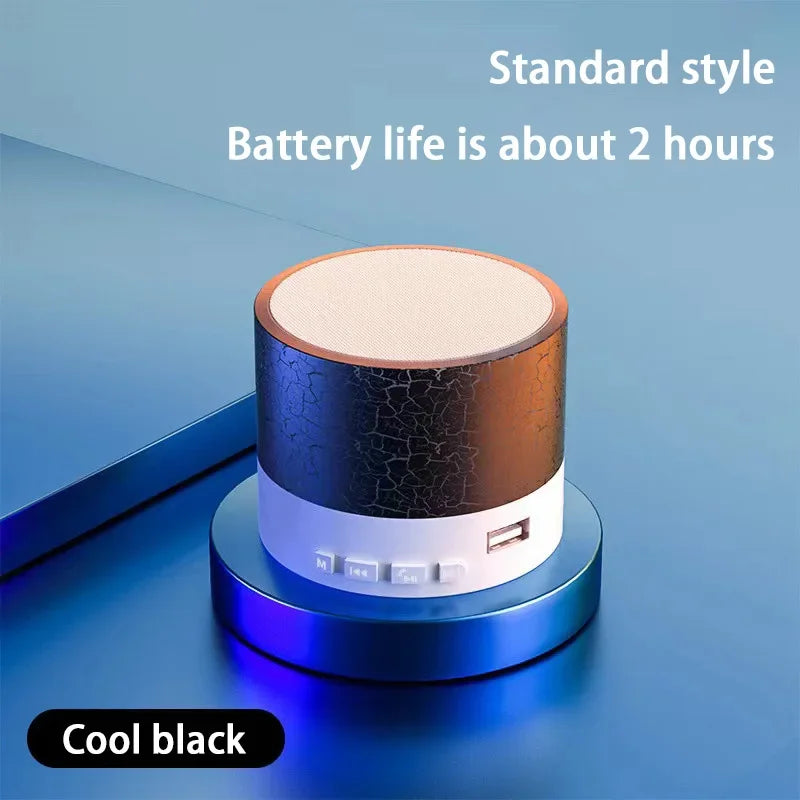 Portable Bluetooth mini speaker, dark/black body with LED ring and control buttons