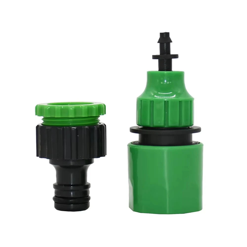 Pair of green quick coupling adapters with black ribbed collars and barbed outlet ends