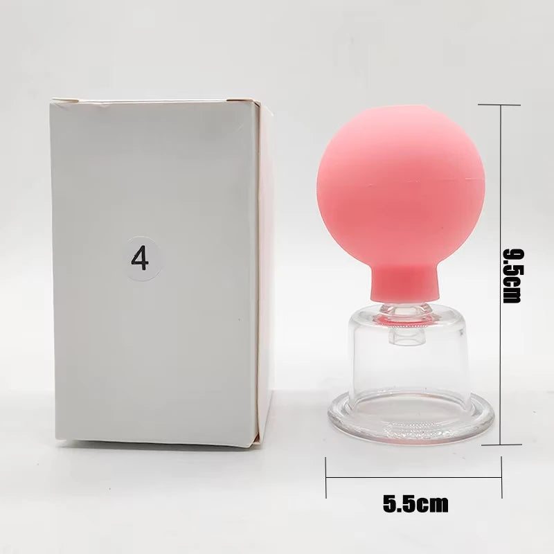 Pink rubber bulb facial cupping tool with a clear glass suction cup next to a white box with a number four sticker.