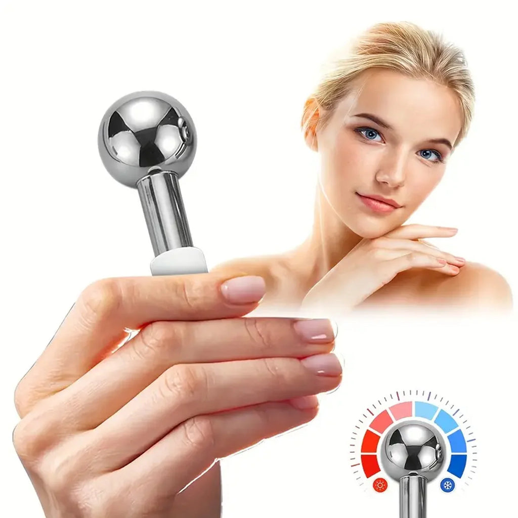 A hand holds a spherical, silver stainless steel cooling facial globe, with a woman posing in the background.