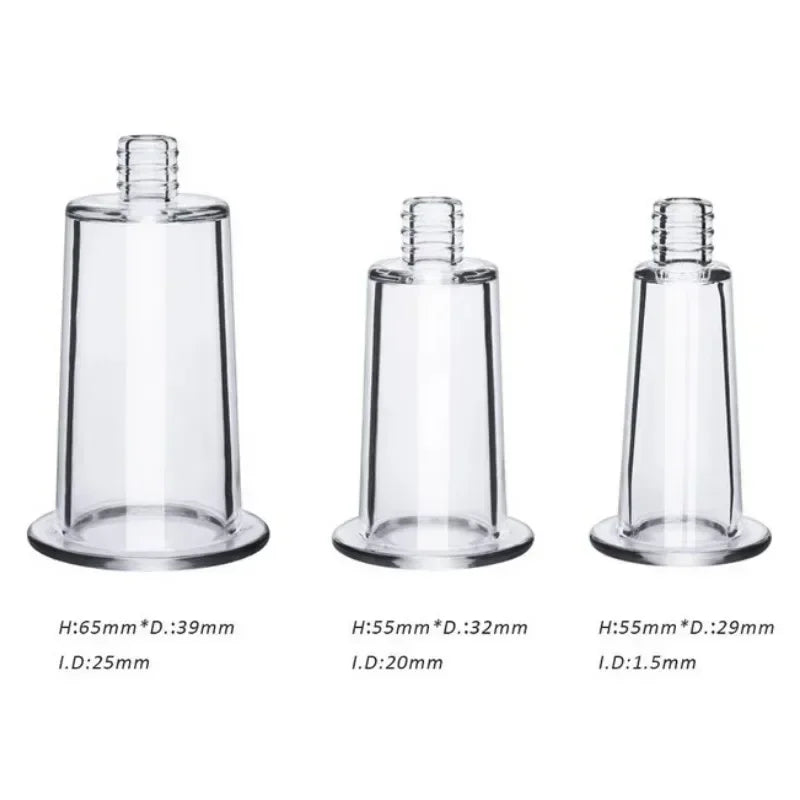 Three transparent, cylindrical vacuum massage cups of varying sizes, each with a narrow threaded top.