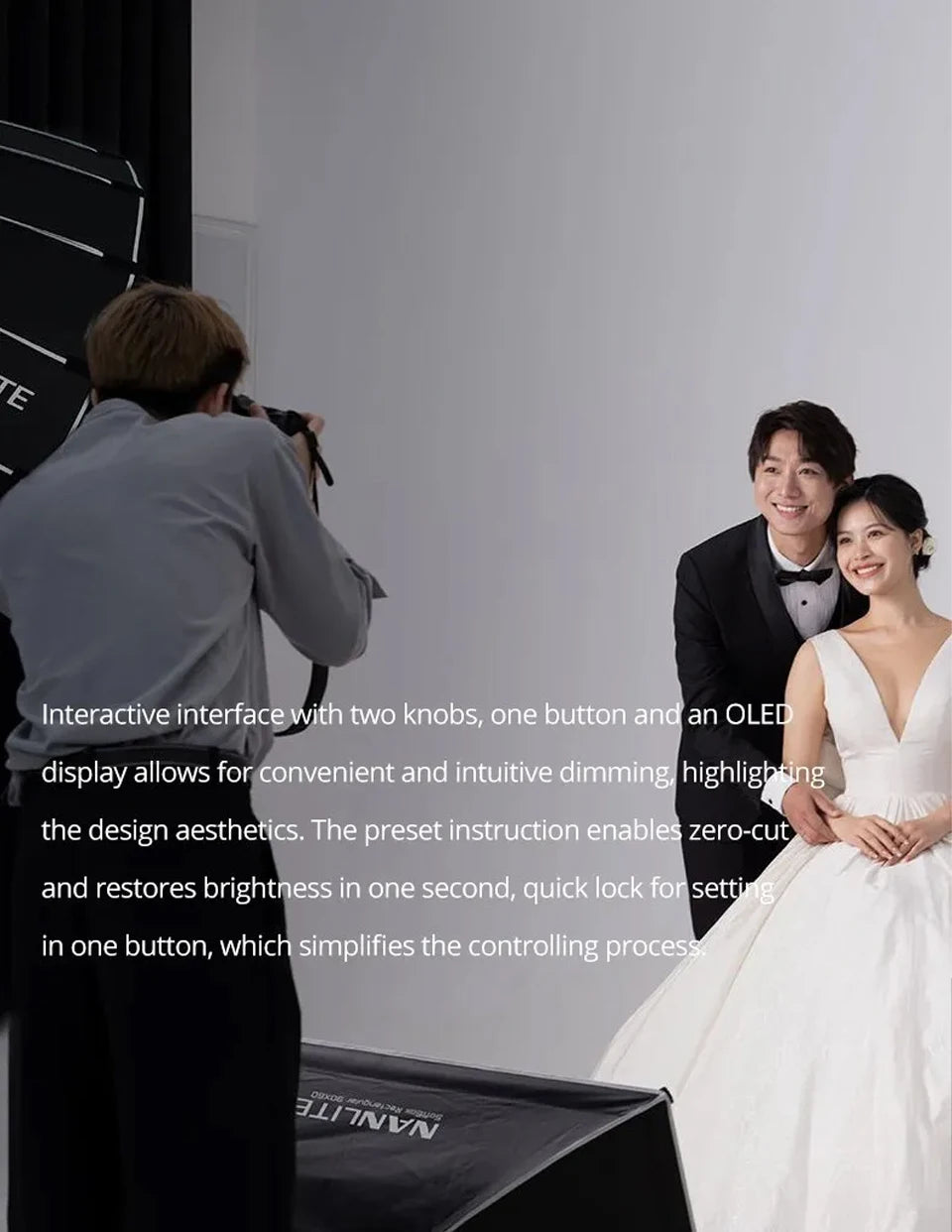 Black rectangular softbox with OLED screen, two knobs, and a button, used for professional photography lighting.