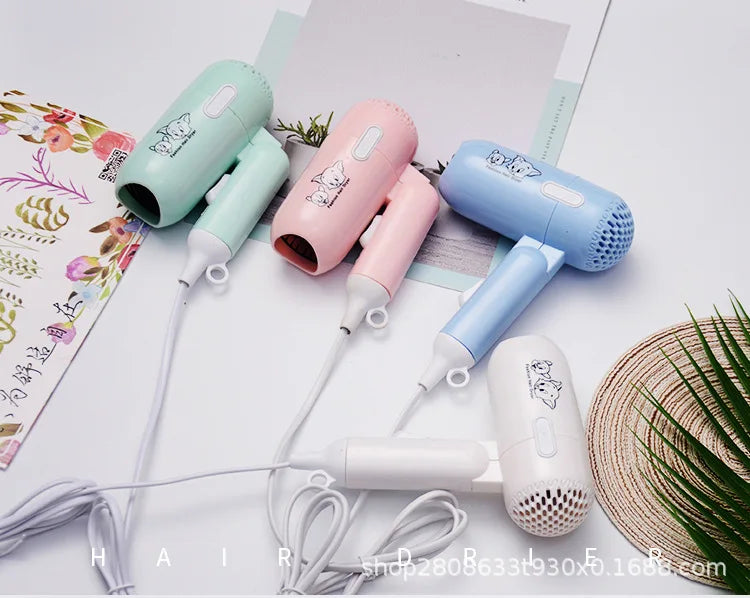 Mini portable folding hair dryers in pastel pink, blue, green, and white for travel, dorm, or salon use. 400W power.