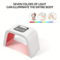 White arched 7-color LED light therapy device for face and body with a digital control panel and red light display.