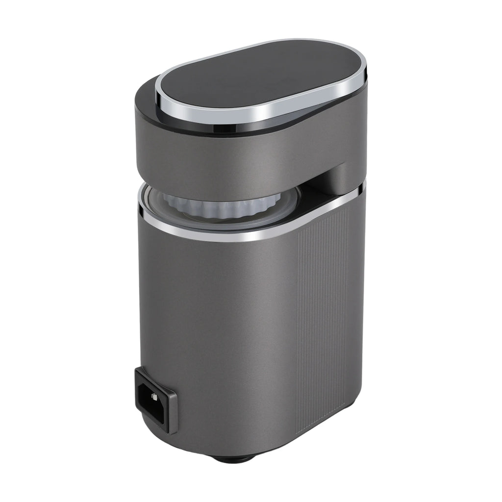 Modern dark grey electric coffee grinder with chrome accents, compact vertical design, and white internal burr.