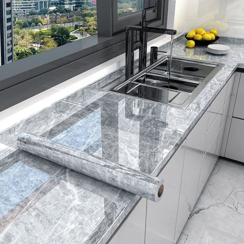 Gray marble-look waterproof self-adhesive wallpaper applied on kitchen counters and backsplash