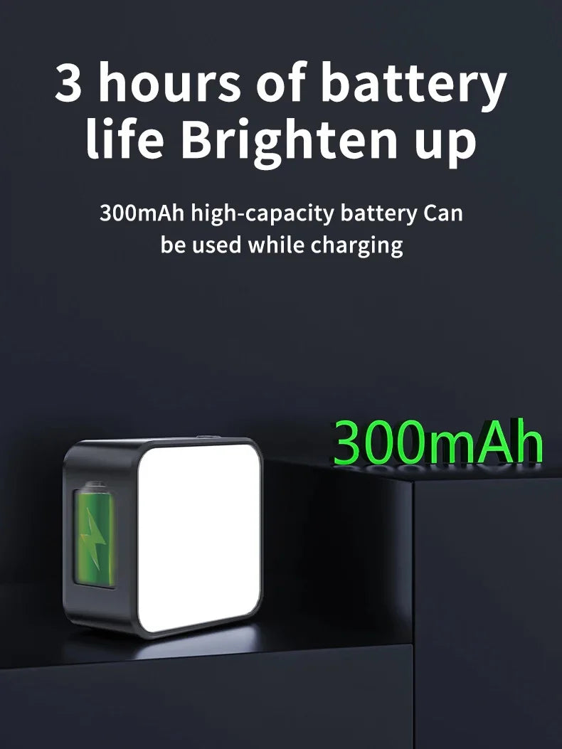 Small, square LED lamp with a black frame and white light panel, featuring a 300mAh rechargeable battery.