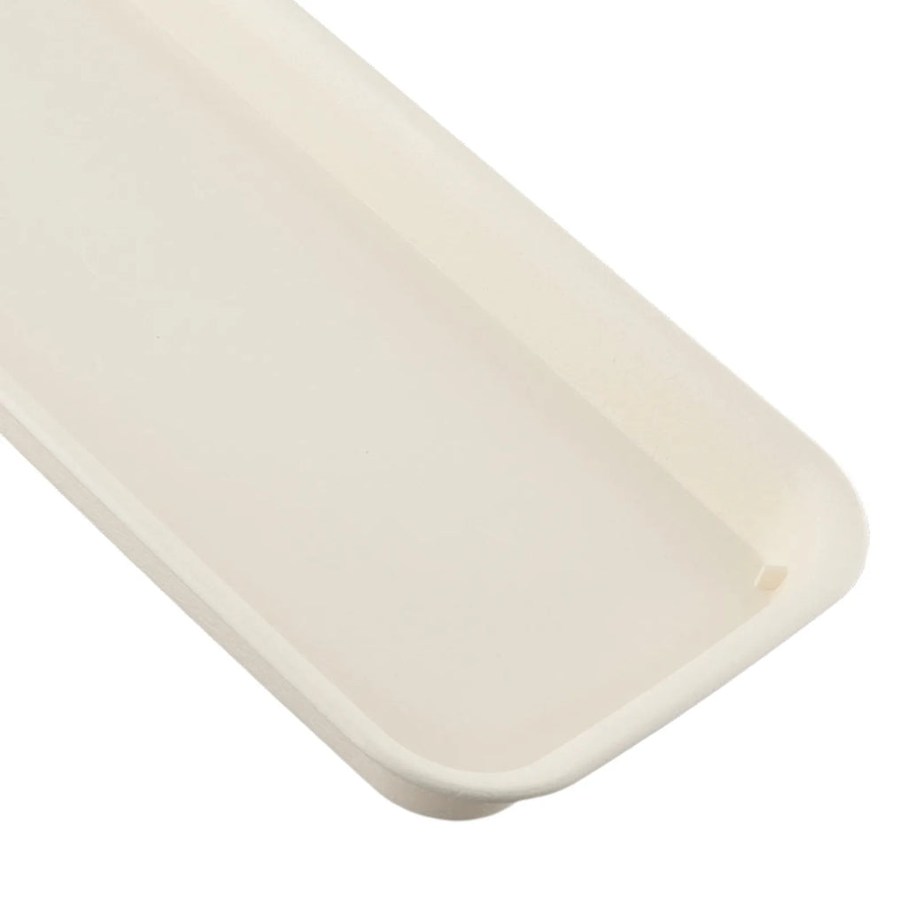 Beige rectangular plastic tray close-up of smooth inner surface and curved rim