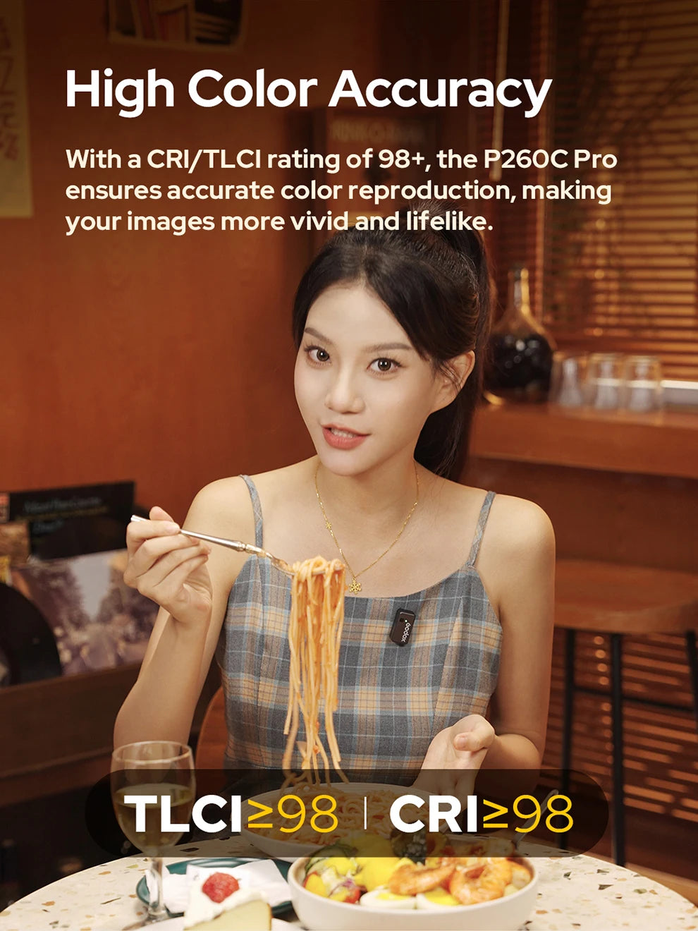 P260C Pro LED light panel showing high color accuracy on a woman eating pasta in a warm, indoor setting.