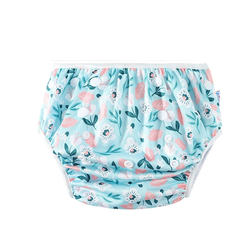 Adjustable reusable cloth baby diaper with white snap buttons and blue floral print for baby care.