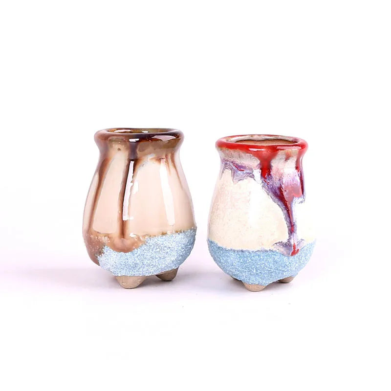 Two mini ice-crack ceramic succulent pots: tan with blue speckle and white/red with blue base