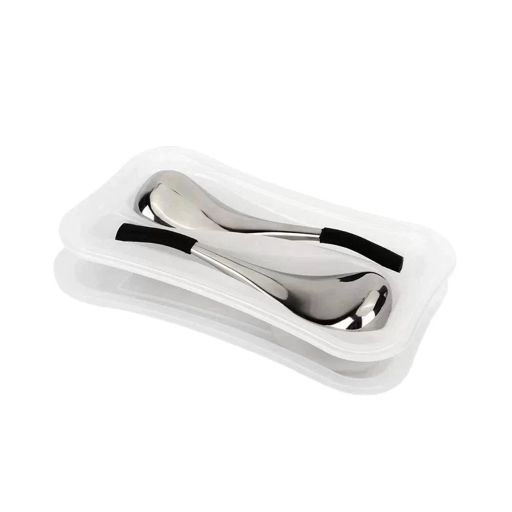 Two silver, teardrop-shaped cooling facial massage globes with black grips, resting in a white plastic storage tray.