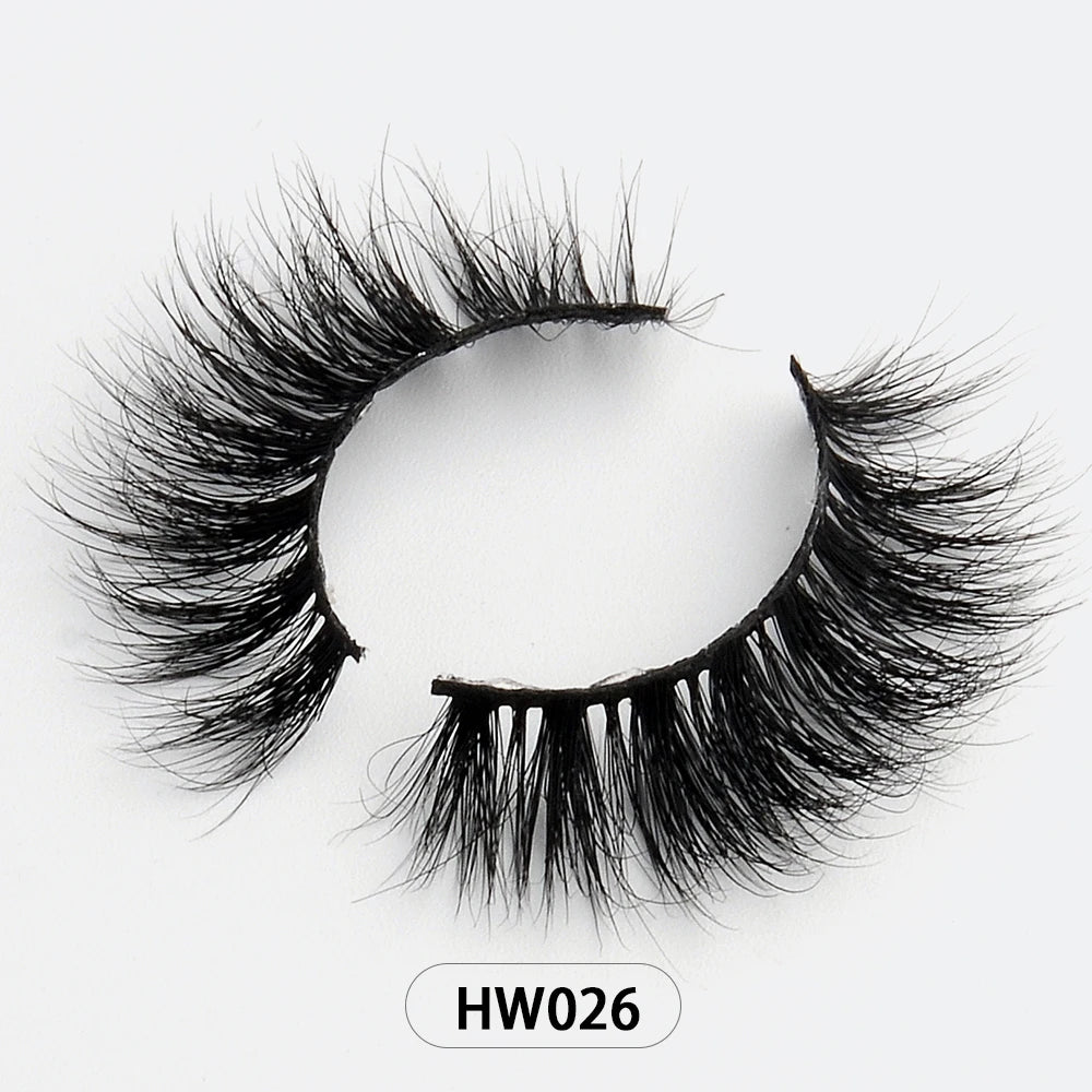 Black 3D mink false eyelashes with a soft, flexible band on a white background, labeled style HW026.