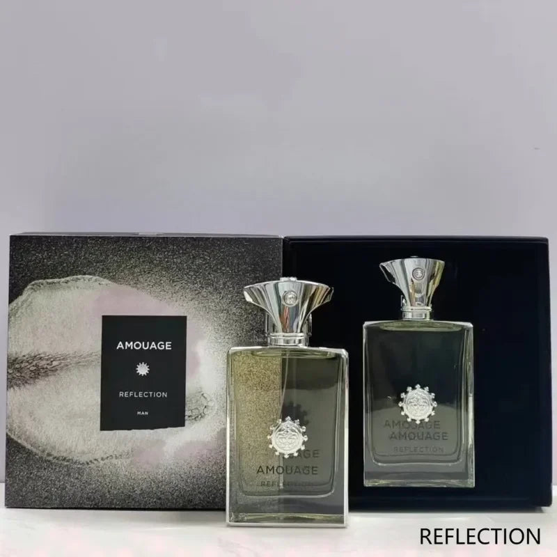 Amouage Reflection Man EDP 100ml: Aromatic woody masculine fragrance in a luxury rectangular glass bottle with gift box.