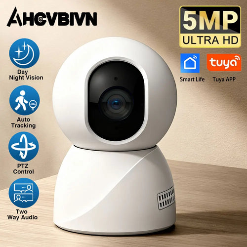 Indoor WiFi security camera with white housing and black dome lens on tabletop