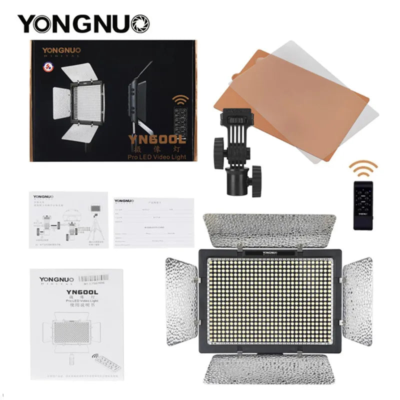 YN600L LED video light kit with four barn doors, remote, mounting bracket, color filters, and instruction manuals.