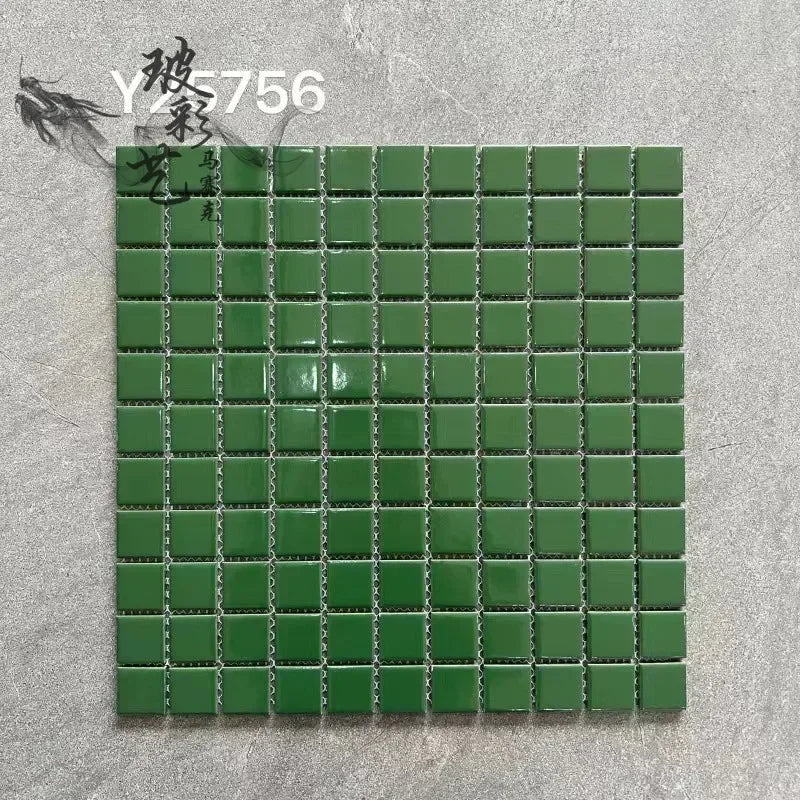 Ceramic mosaic tile sheet with small square green tiles on grid backing