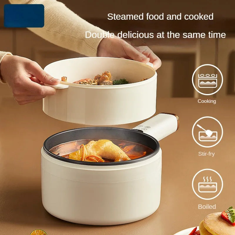 White electric cooking pot with black lid inner base and food being served