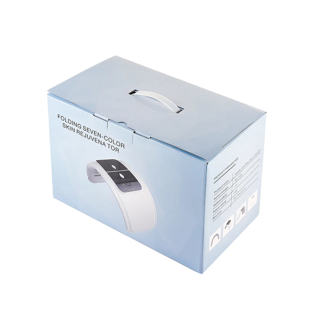 Light blue product box for a folding seven-color LED skin rejuvenation therapy mask with a top carrying handle.