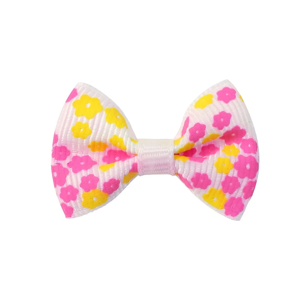 Colorful floral pet hair bow clip for small dogs and cats, perfect for stylish grooming and easy accessory styling.