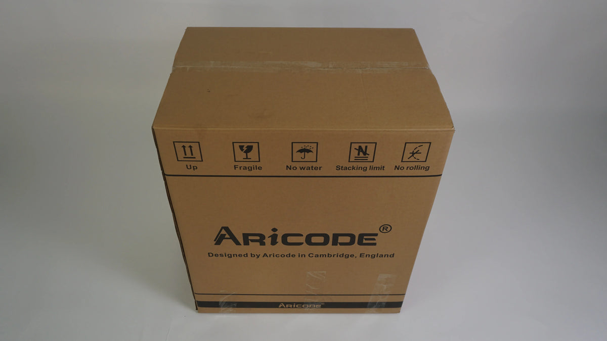 AriCODE shipping box in brown cardboard with handling icons