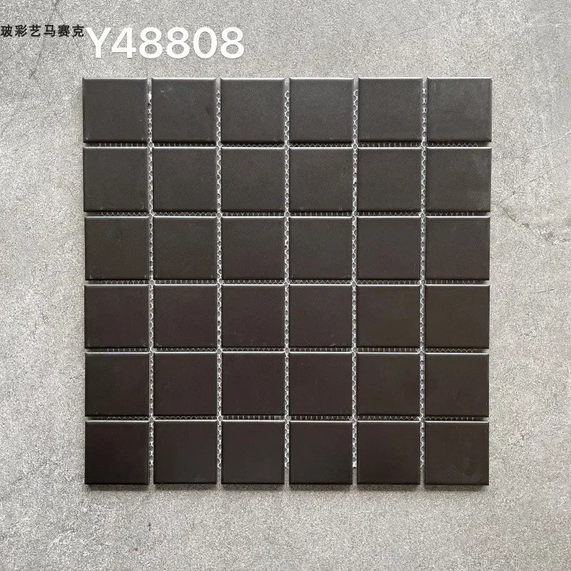 Charcoal dark ceramic mosaic tile sheet with glossy square grid and light grout lines