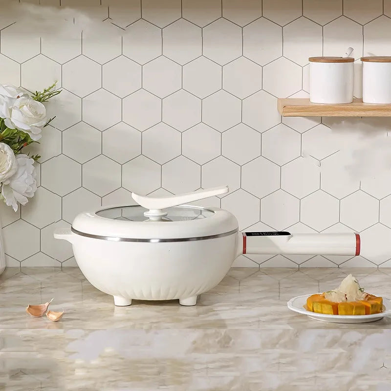 Electric cooking pot with lid and steam valve, countertop use view