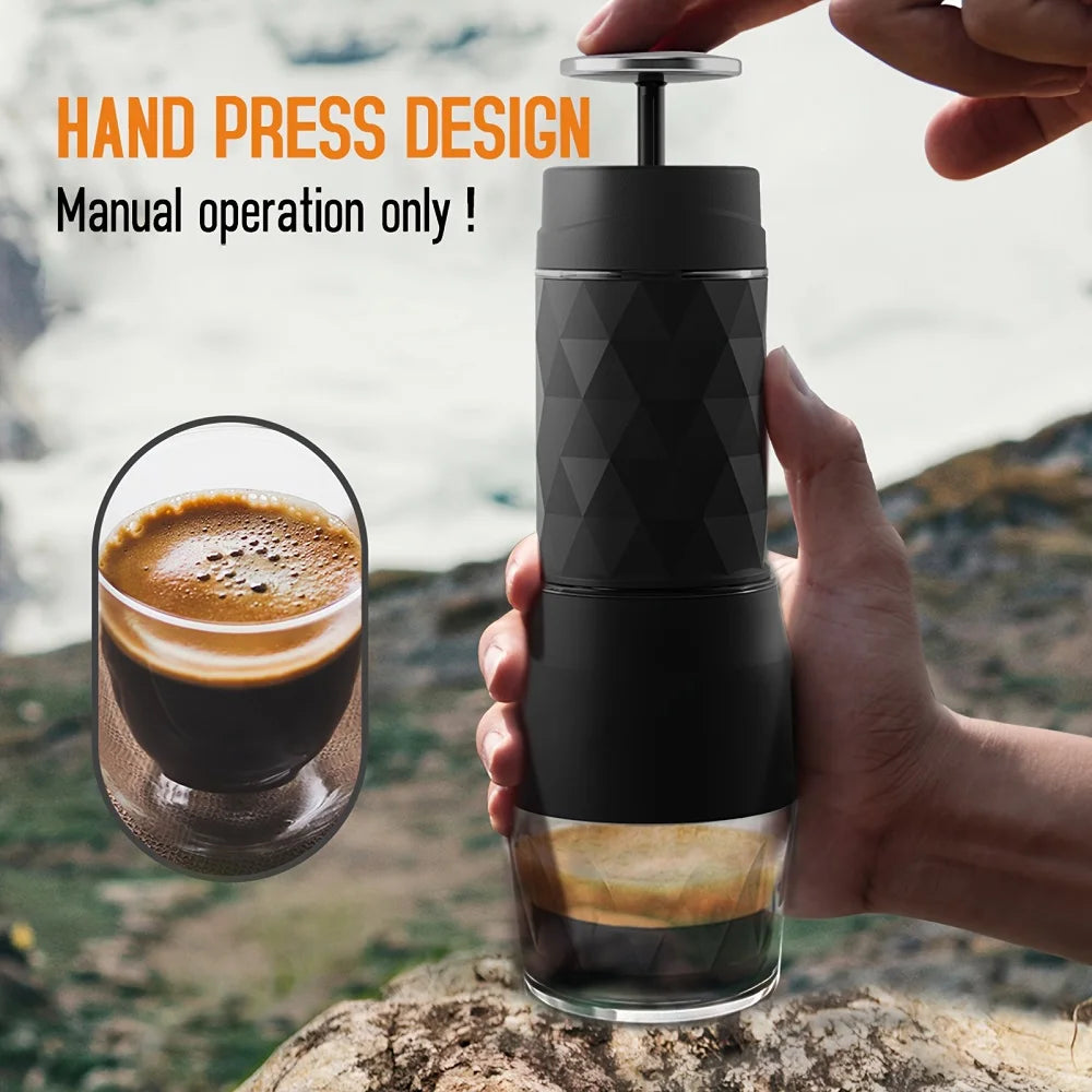 Portable black manual hand-press espresso maker with geometric texture design for outdoor coffee brewing.