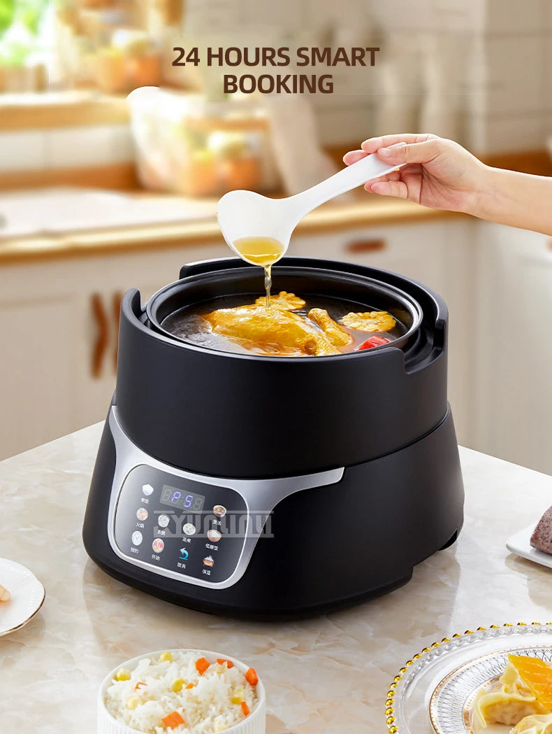 Black electric rice cooker with glass lid and pouring spout, showing display control panel