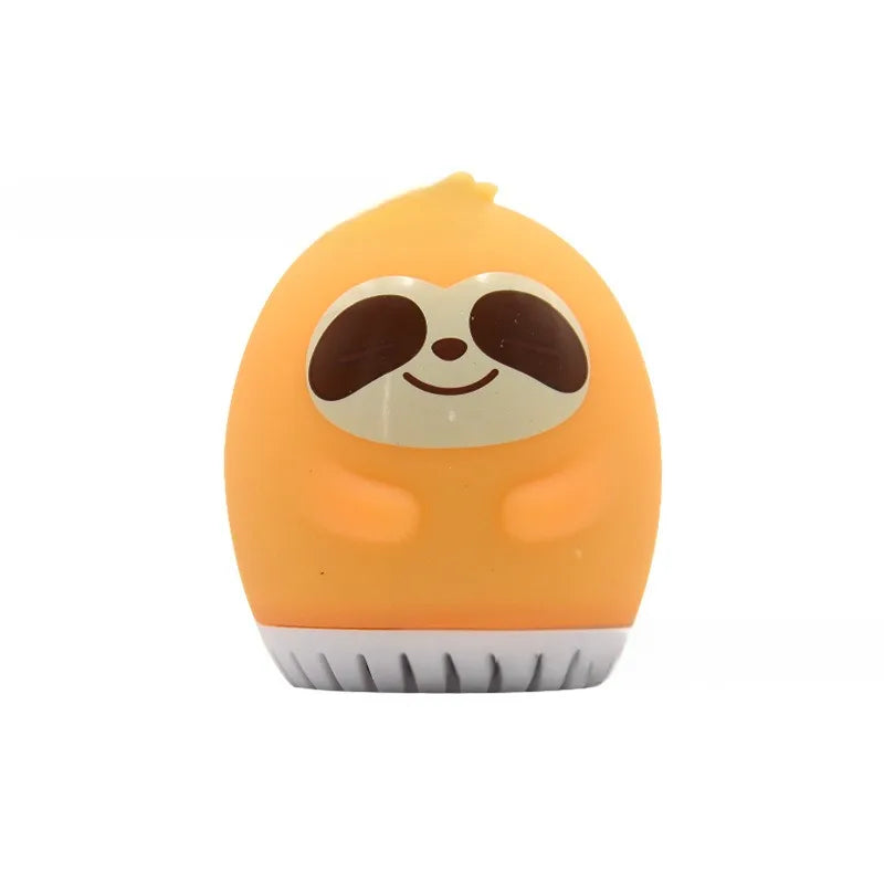 Orange sloth sleep aid sound machine with white speaker base and smooth, button-free design for baby sleep.