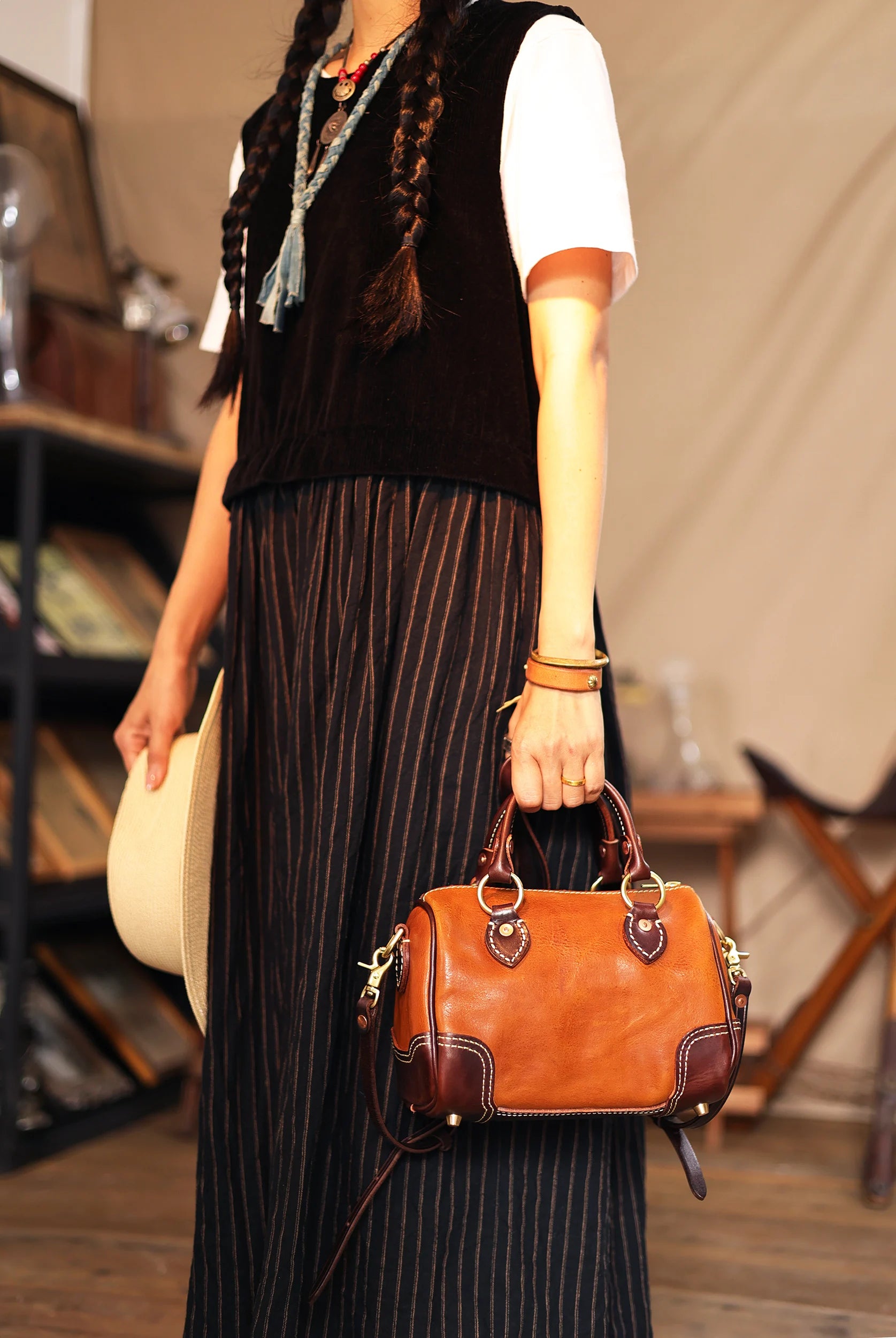 PNDME vintage handmade small brown cowhide leather handbag with dark brown trim and gold hardware. Designer shoulder bag.