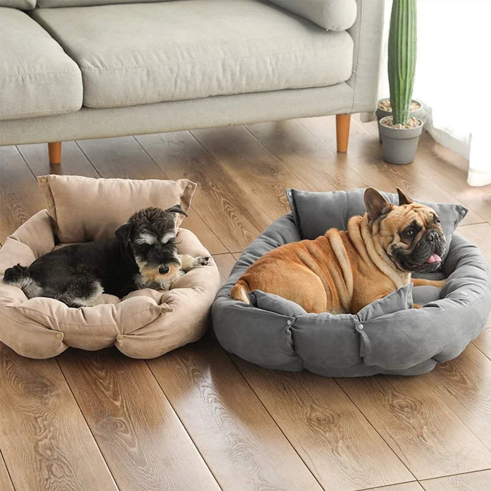 Two dogs relaxing on cozy, plush, washable sofa beds in beige and grey for warm, comfortable pet sleeping.