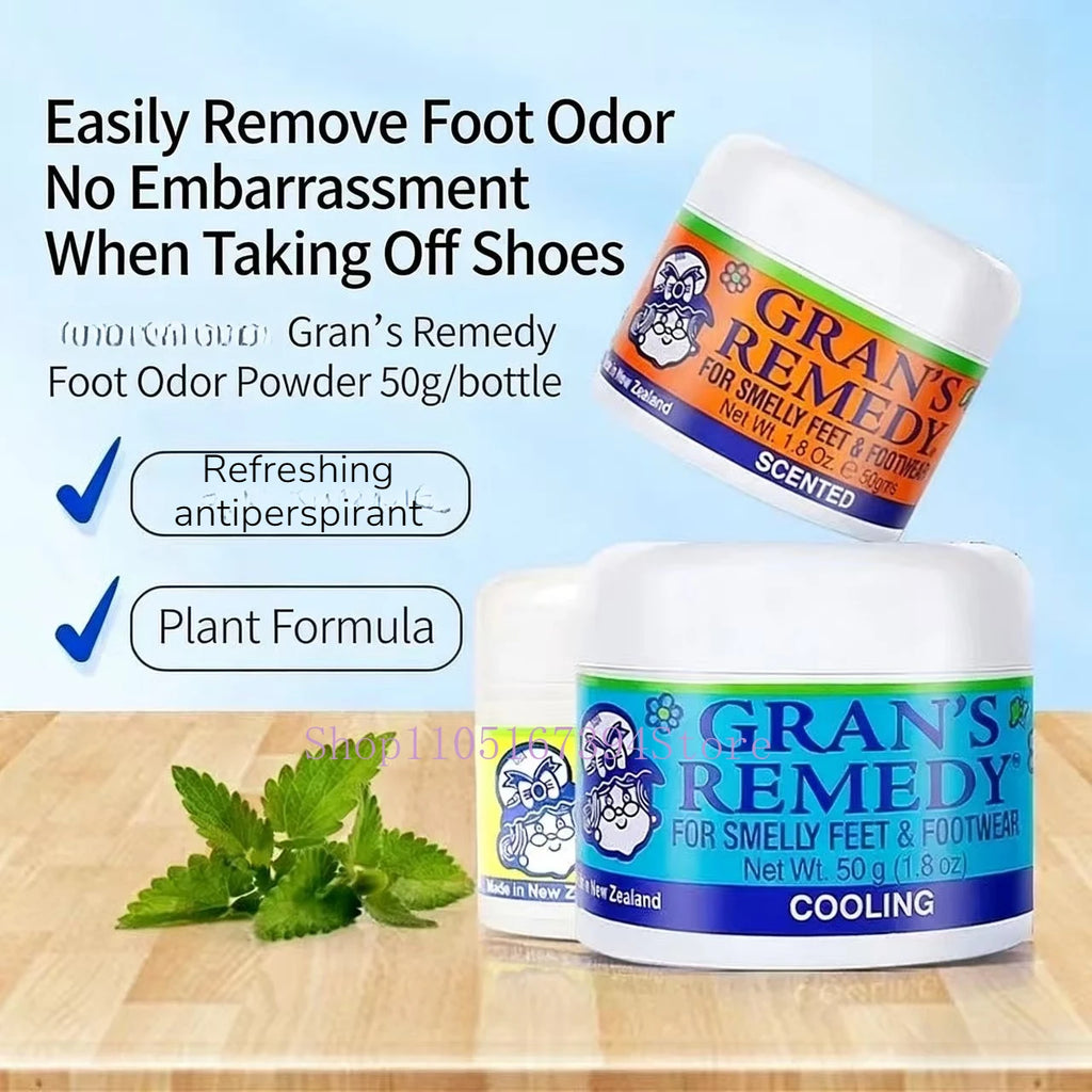 Gran's Remedy foot powder jars in white with blue and orange labels for odor control on a wooden surface with green leaf.