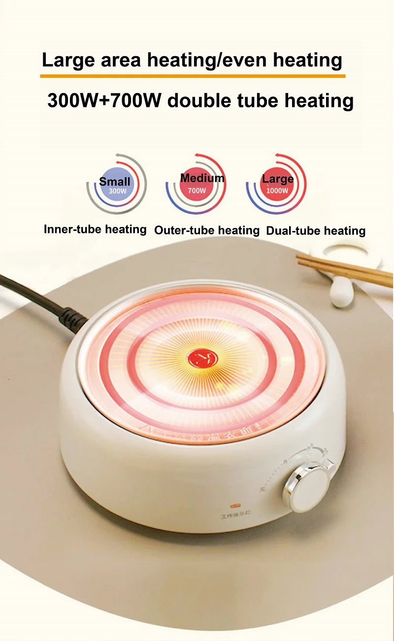 White electric hot pot with glowing circular heating element.