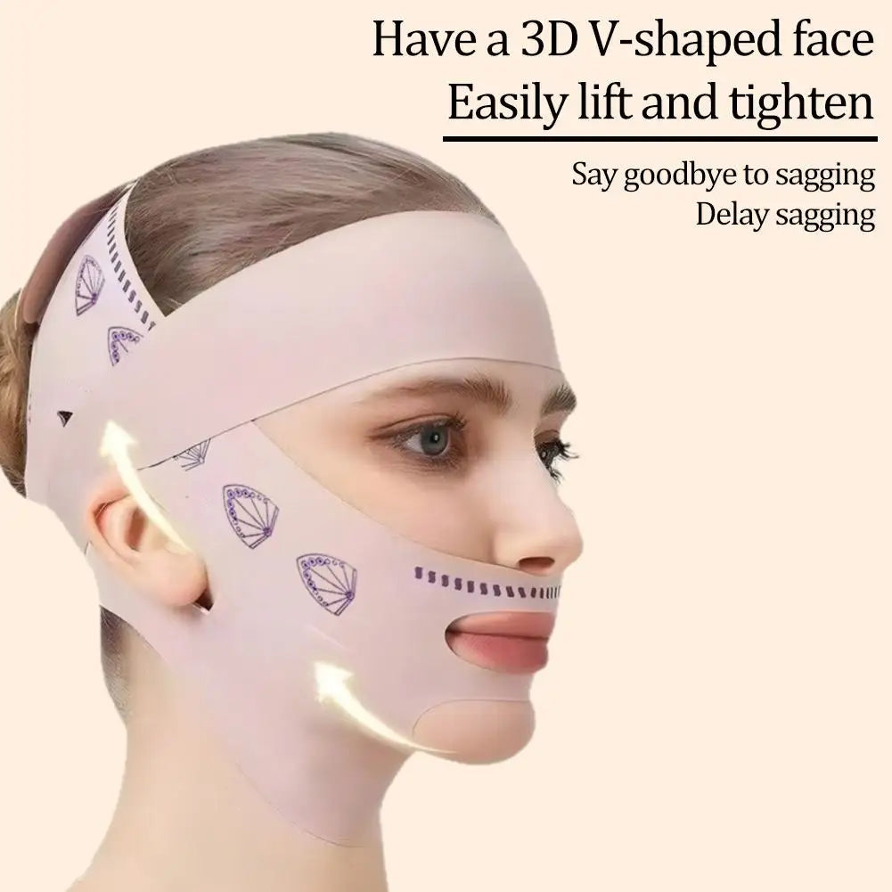 A person wears a light pink, reusable facial slimming mask with a patterned strap that lifts the chin and jawline.
