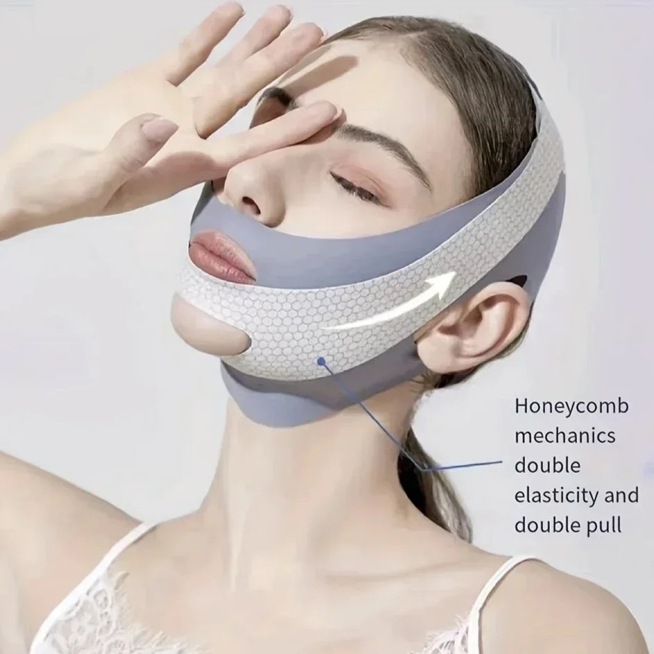 A woman wears a grey, breathable V-line face slimming bandage featuring a textured honeycomb pattern.