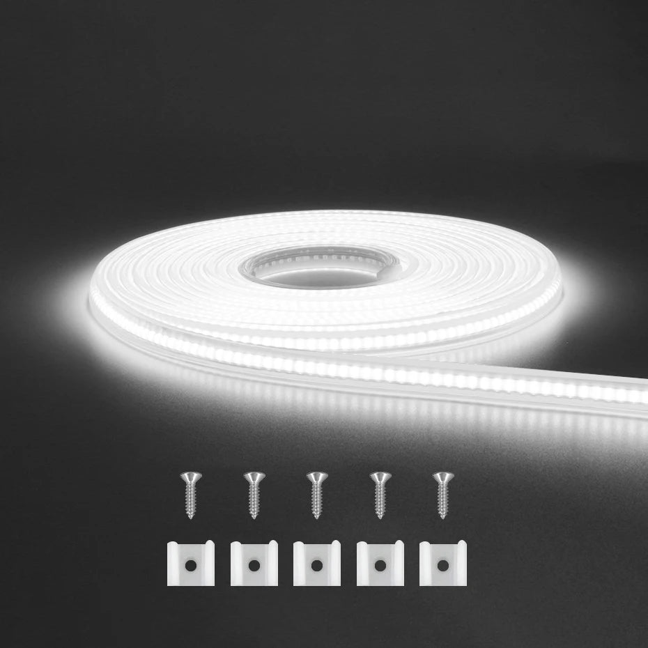 Flexible COB LED strip light roll emitting cool white with mounting clips