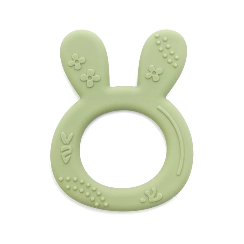 Sage green silicone bunny teething ring for baby teething relief.