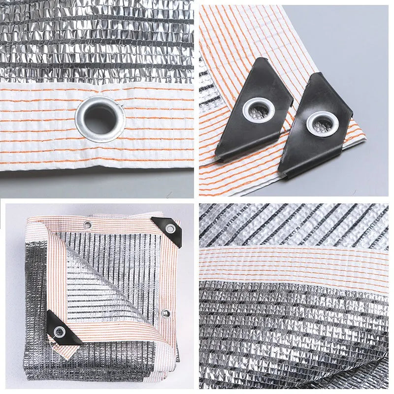 Aluminum foil sunshade net screen detail: silver mesh, orange stripes, round grommets